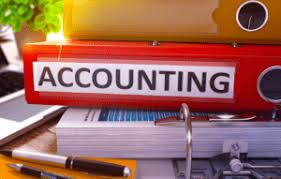 Stack of binders with a red one labeled Accounting