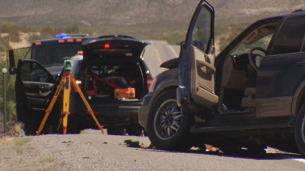 Post-accident scene showing car with damage and equipment on site
