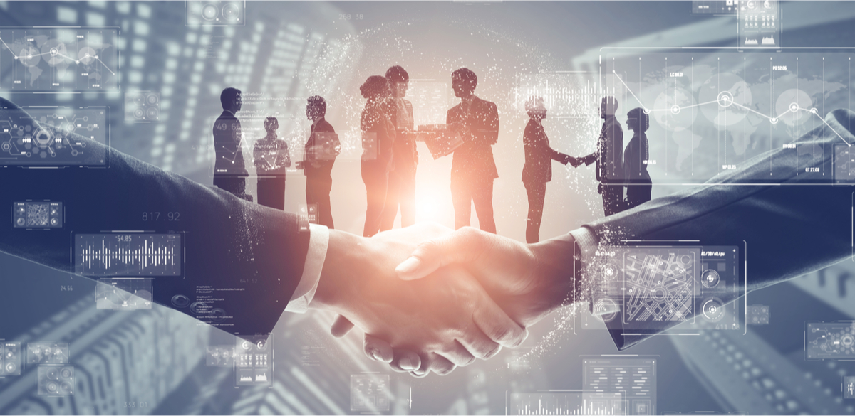 Two shaking hands wearing suites with silhouettes of people superimposed with symbols of technology